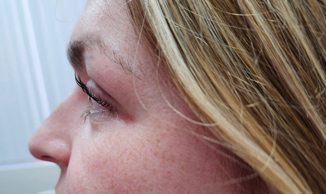 Close-up side view of a lash lift client with naturally curled lashes — Korean lash lift technique by Lifted Lounge