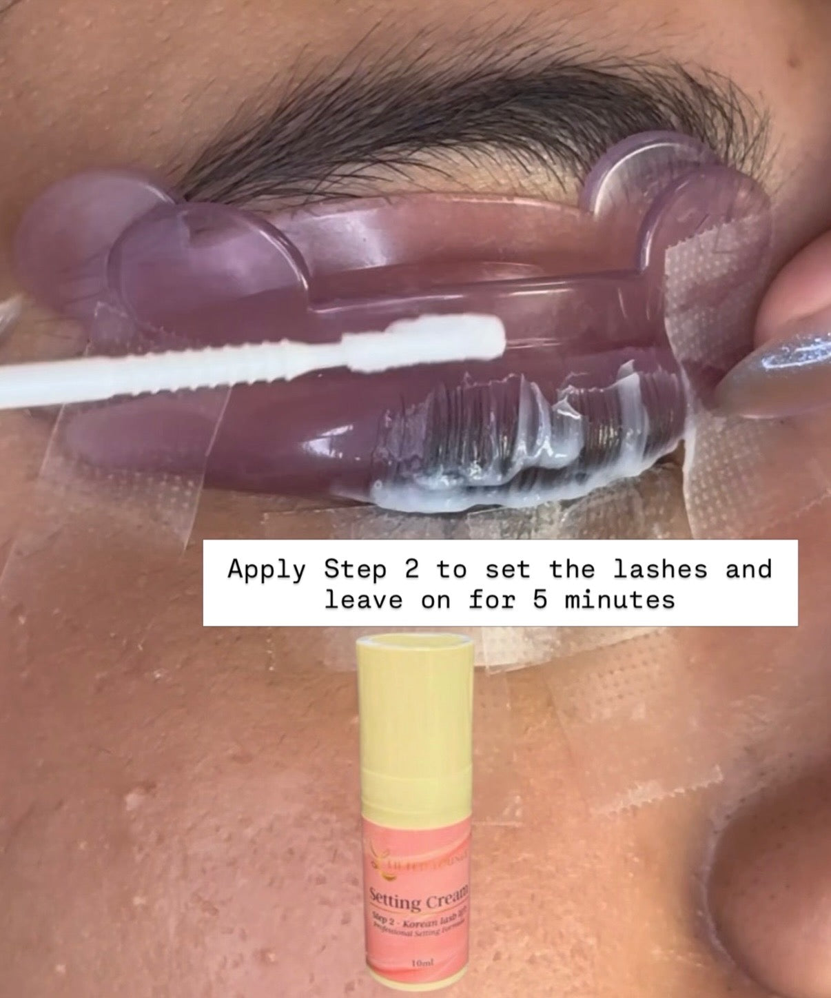 Korean lash lift Step 2 Setting Cream application – applying Lifted Lounge Perm Solution Step 2 on client lashes for 5 minutes