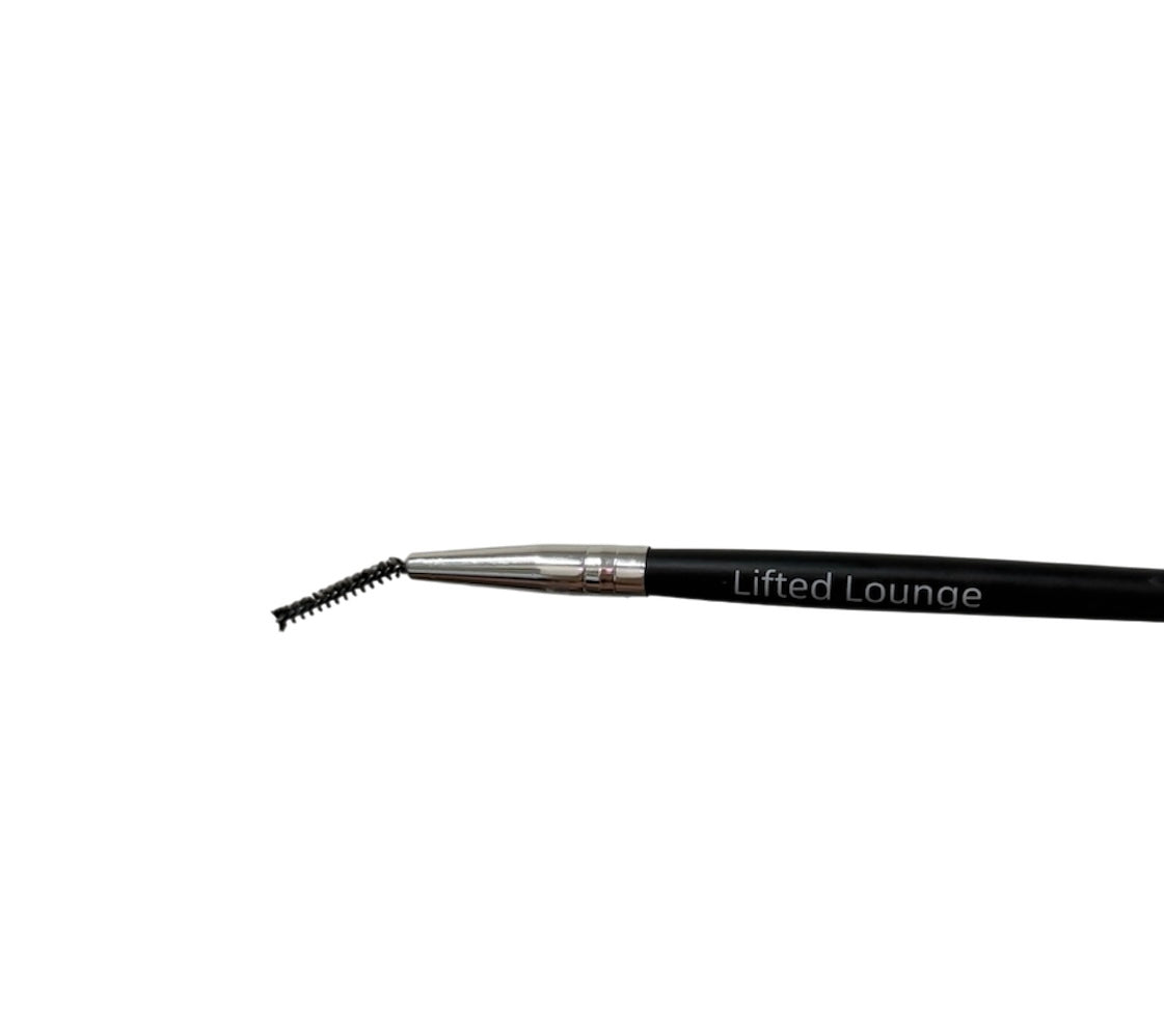Close-up of Lifted Lounge precision detailing brush showing slim angled brush tip ideal for separating lashes and shaping brows